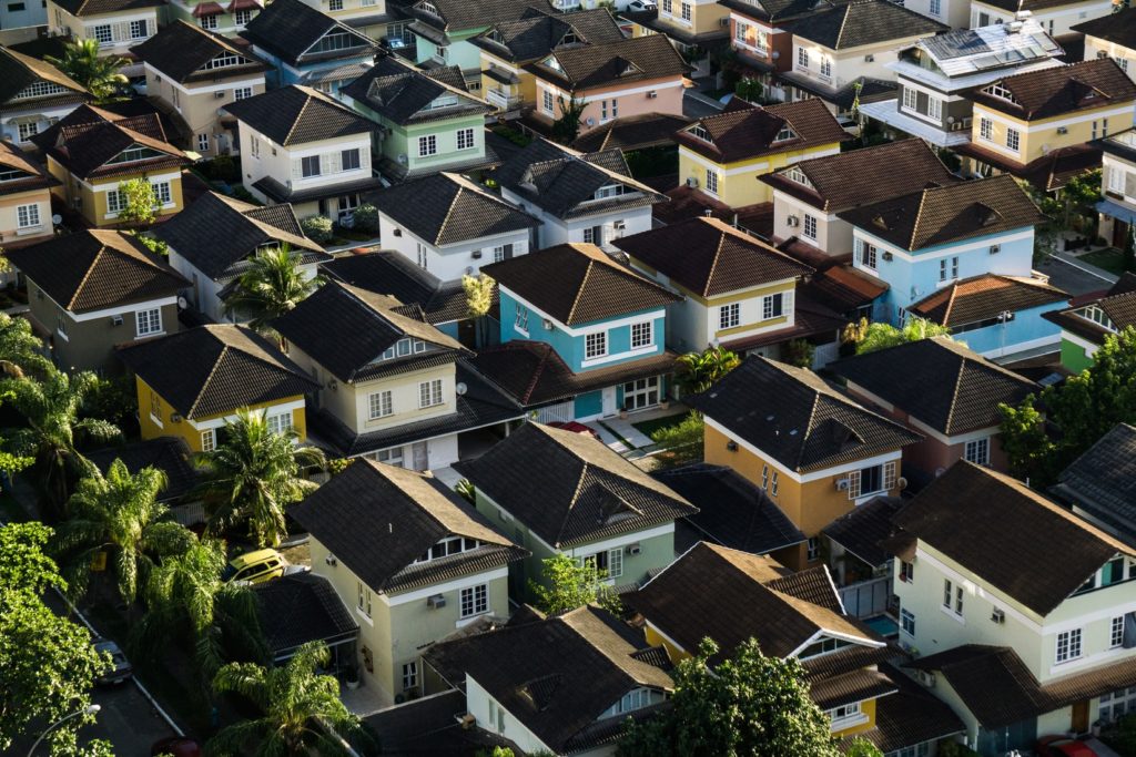 Row of homes representing real estate investing